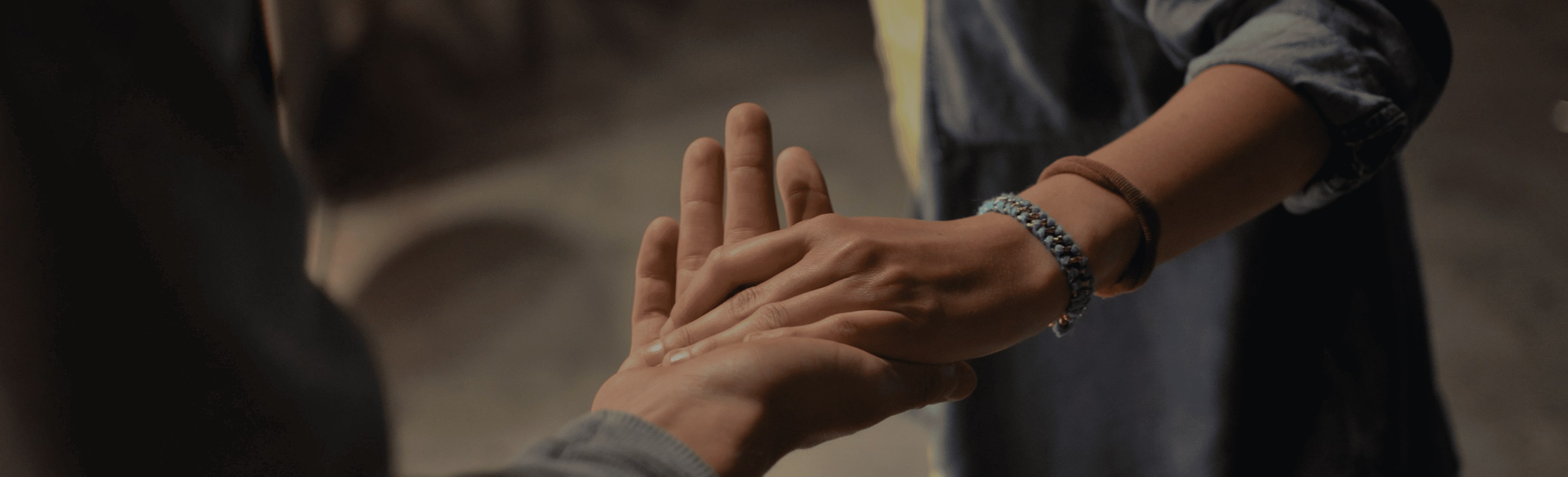 Two people holding hands